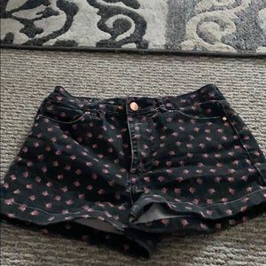 Black shorts with decorative roses.